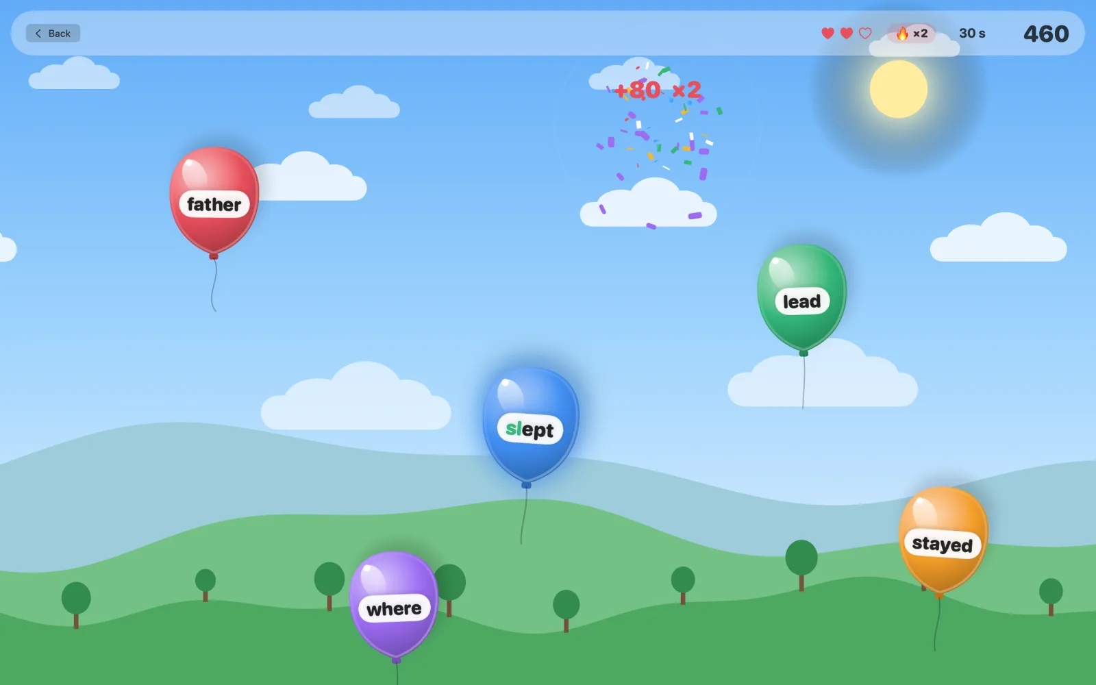 The balloon game: words float up on coloured balloons and pop when they are typed.